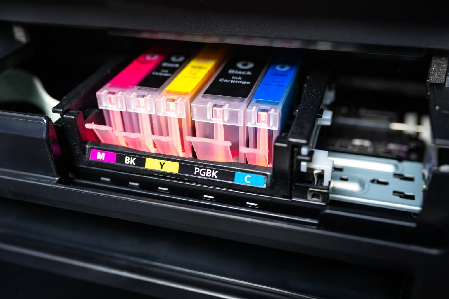 Close Up Shot Of A Cmyk Ink Cartridges In A Color Printer  1536x1025 