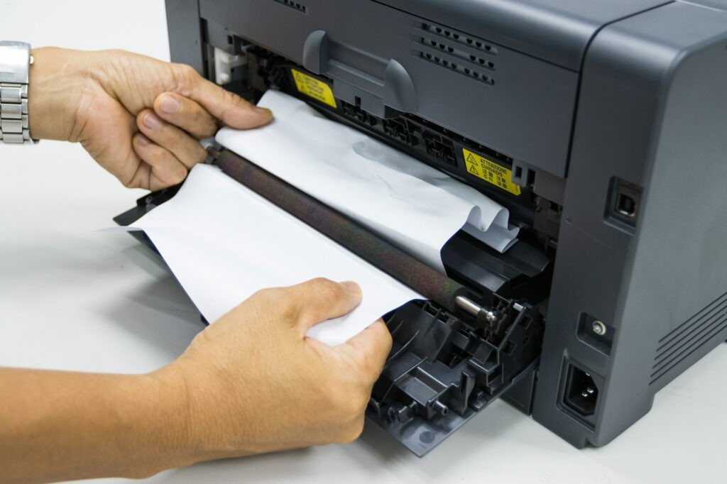Technicians replacing toner in laser printer concept office supplies repair
